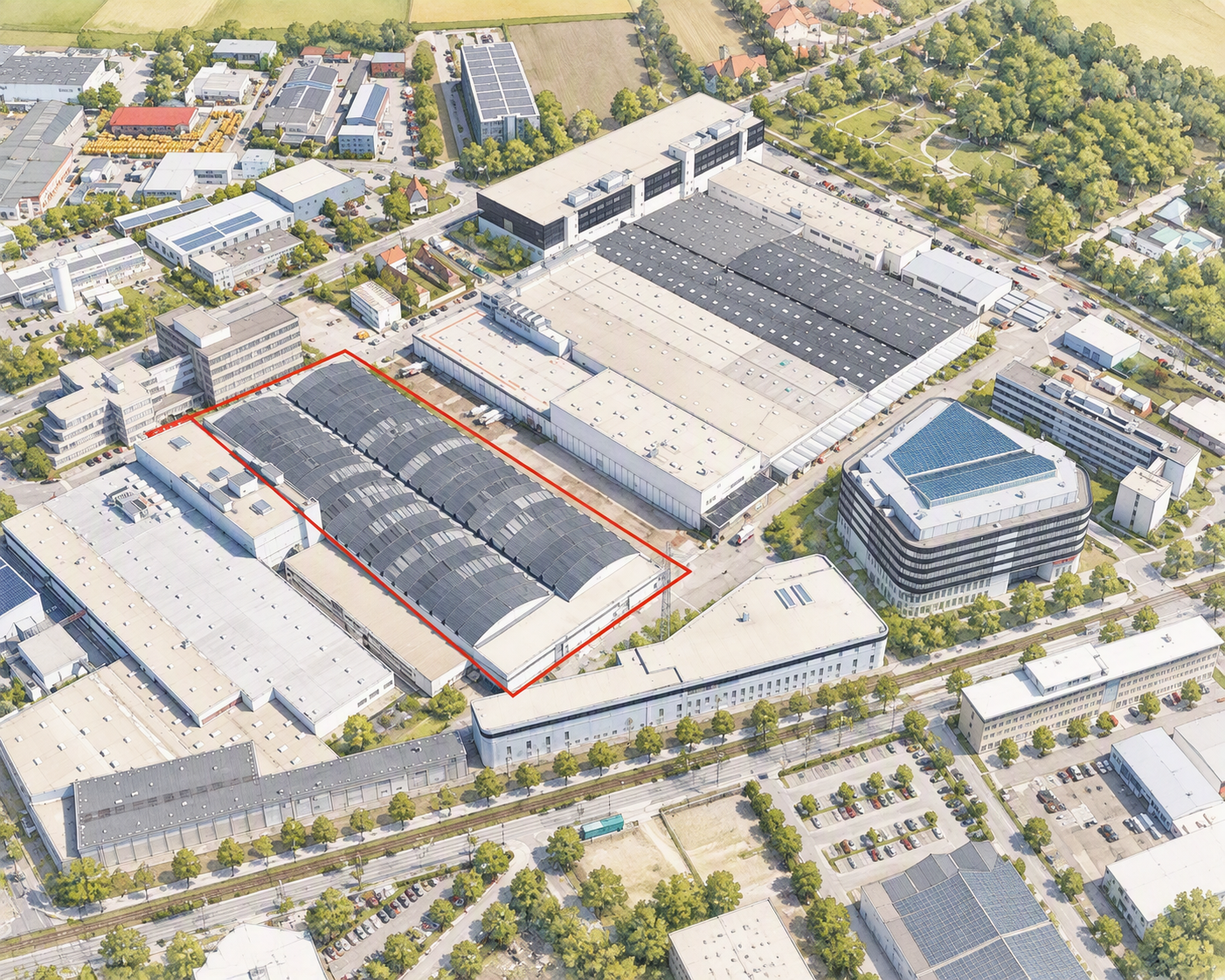 Aerialaufnahme eines Industrie- und Werksgeländes mit markiertem Gebäudebereich innerhalb eines großen Produktionskomplexes