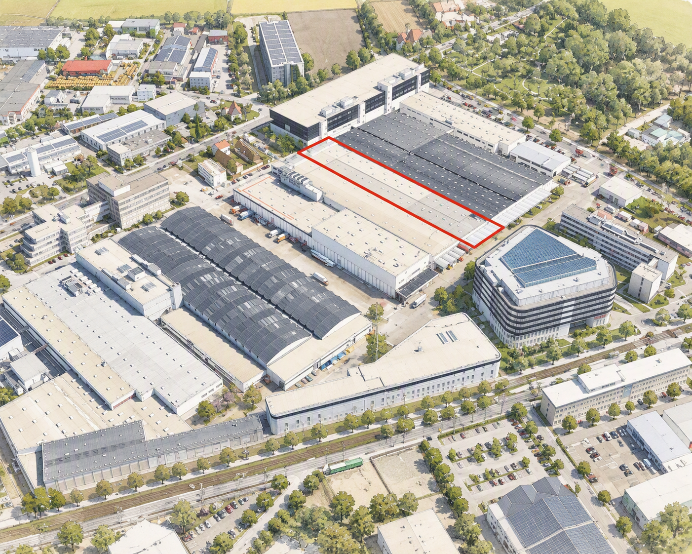 Aerialaufnahme eines Industrie- und Werksgeländes mit rechteckigem, rot markiertem Hallenbereich innerhalb eines großen Produktionskomplexes