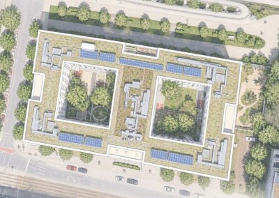 Luftaufnahme eines großen Bürokomplexes mit begrüntem Innenhof und Solaranlagen auf dem Dach