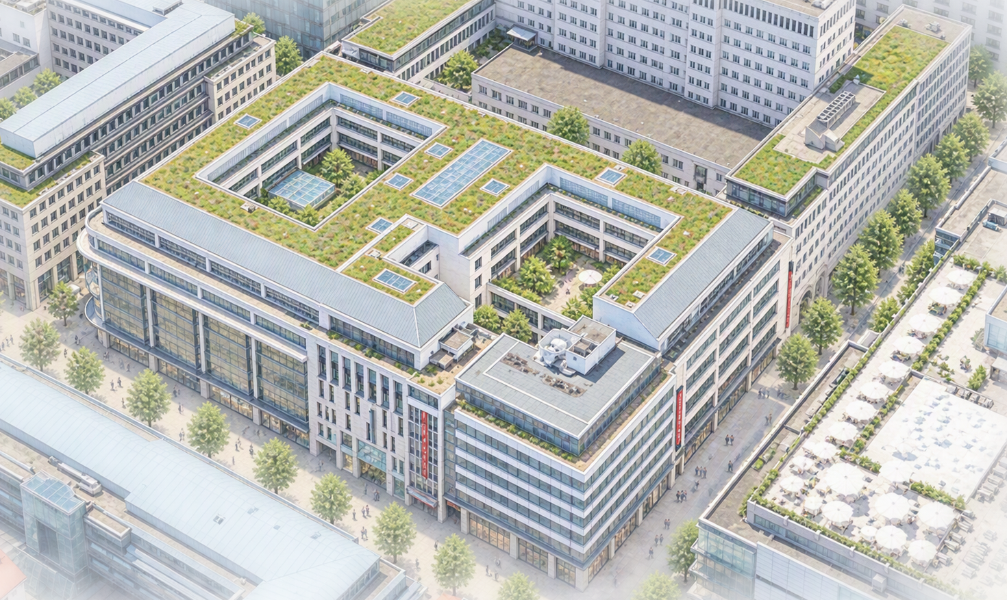 Schrägansicht eines großen, U‑förmigen Gebäudeblocks mit begrünten Dachflächen in dicht bebauter Innenstadtlage.